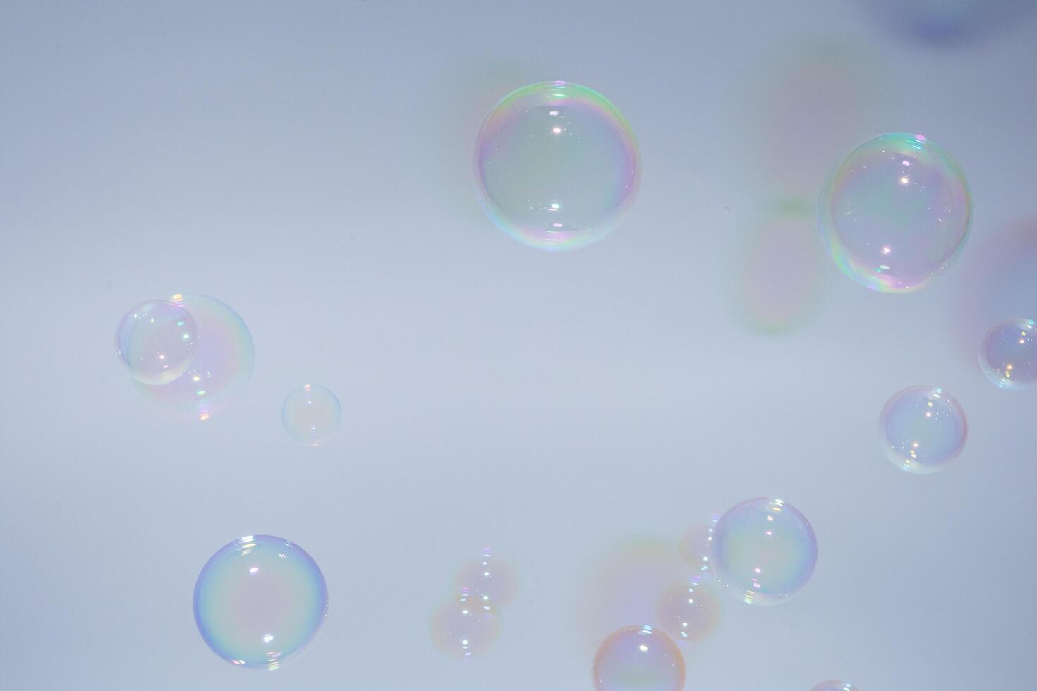 Bubbles in front of greyish-white background photo