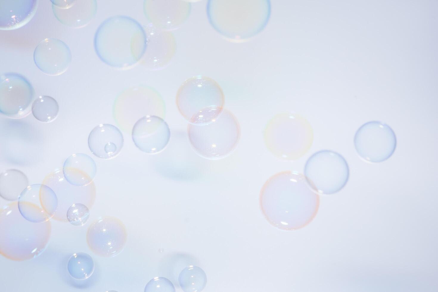 Bubbles in front of greyish-white background photo