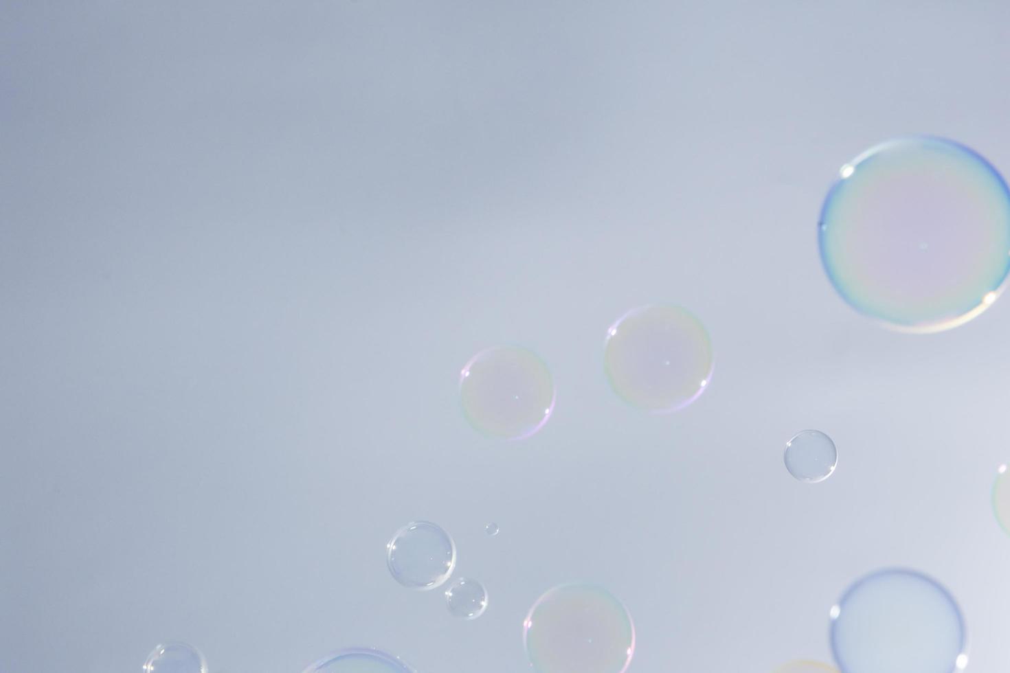 Bubbles in front of greyish-white background photo