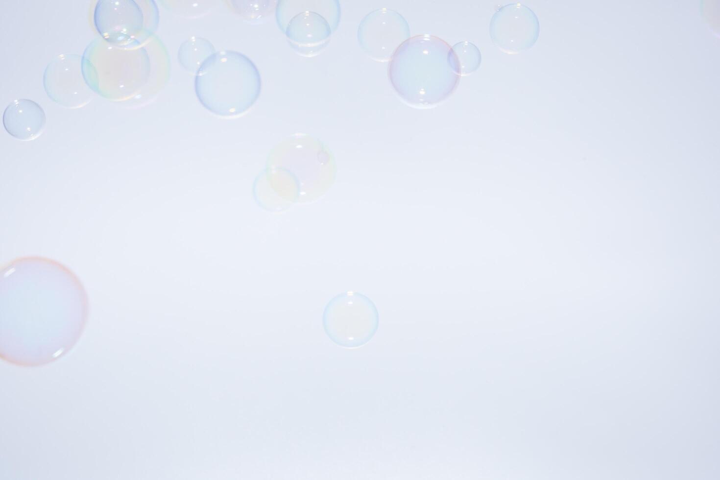 Bubbles in front of greyish-white background photo