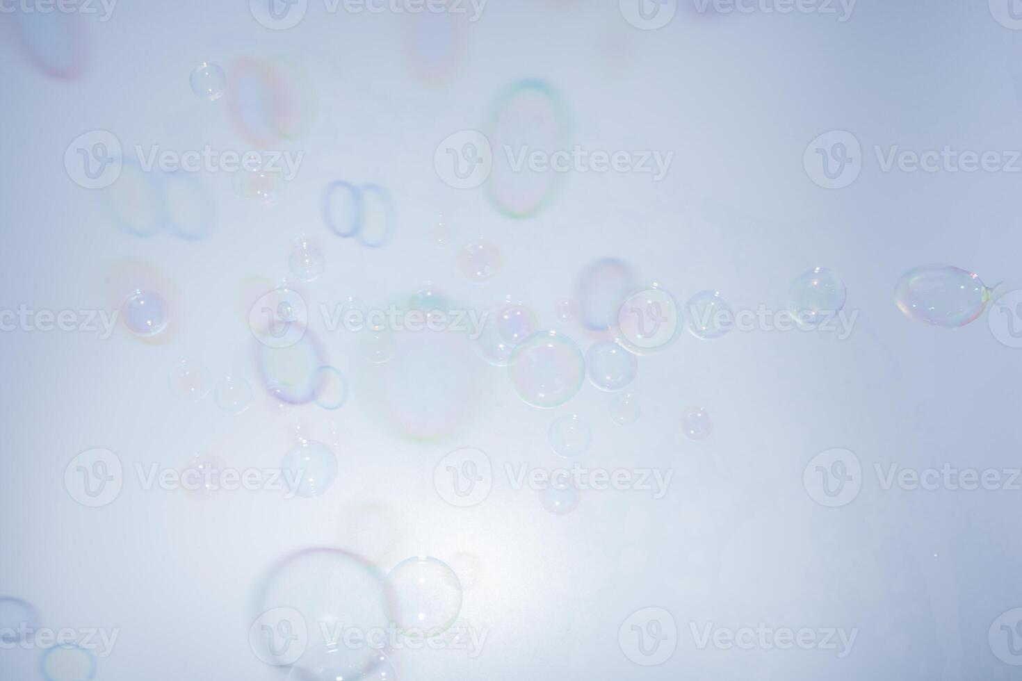 Soap bubbles on a blue background photo
