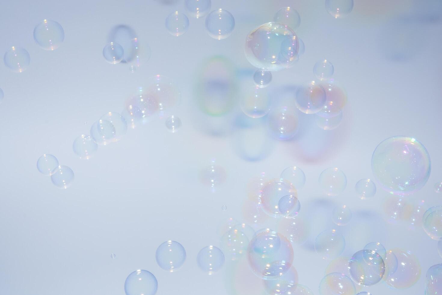 Bubbles in front of greyish-white background photo