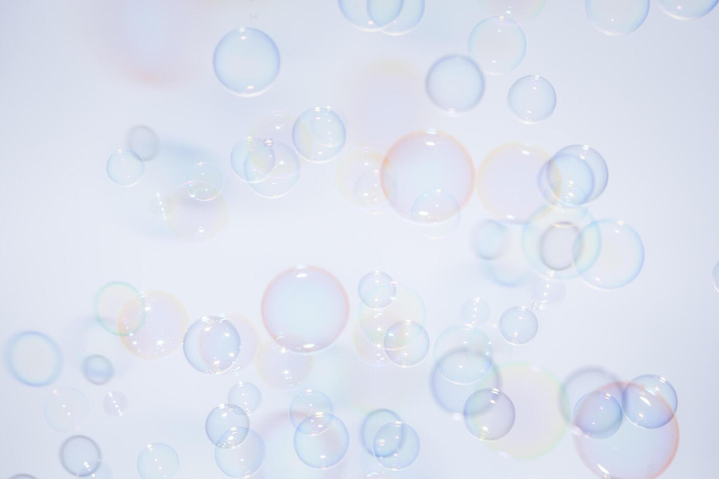 Bubbles in front of greyish-white background photo