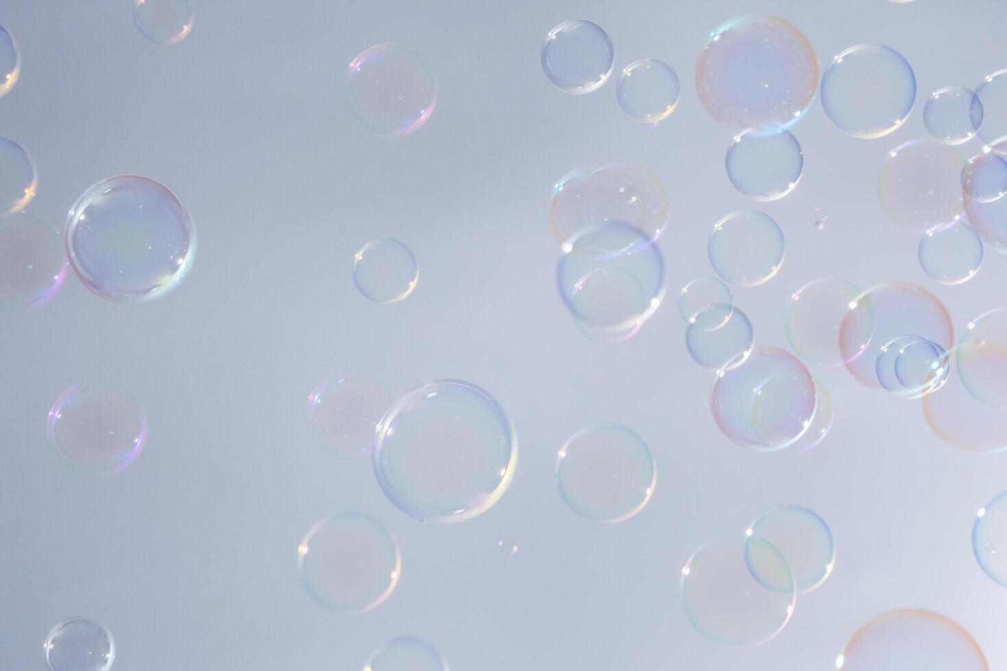 Bubbles in front of greyish-white background photo