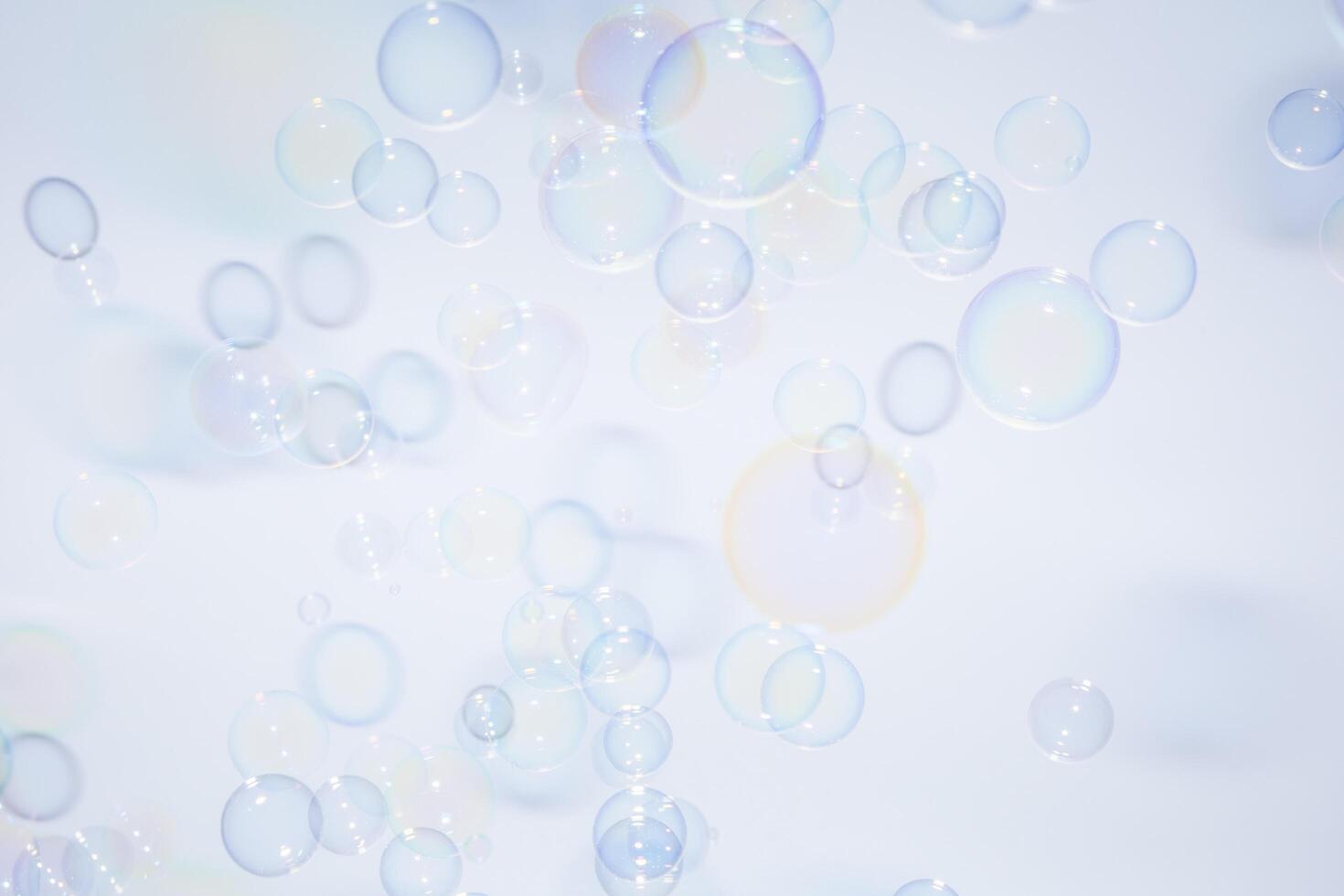 Bubbles in front of greyish-white background photo