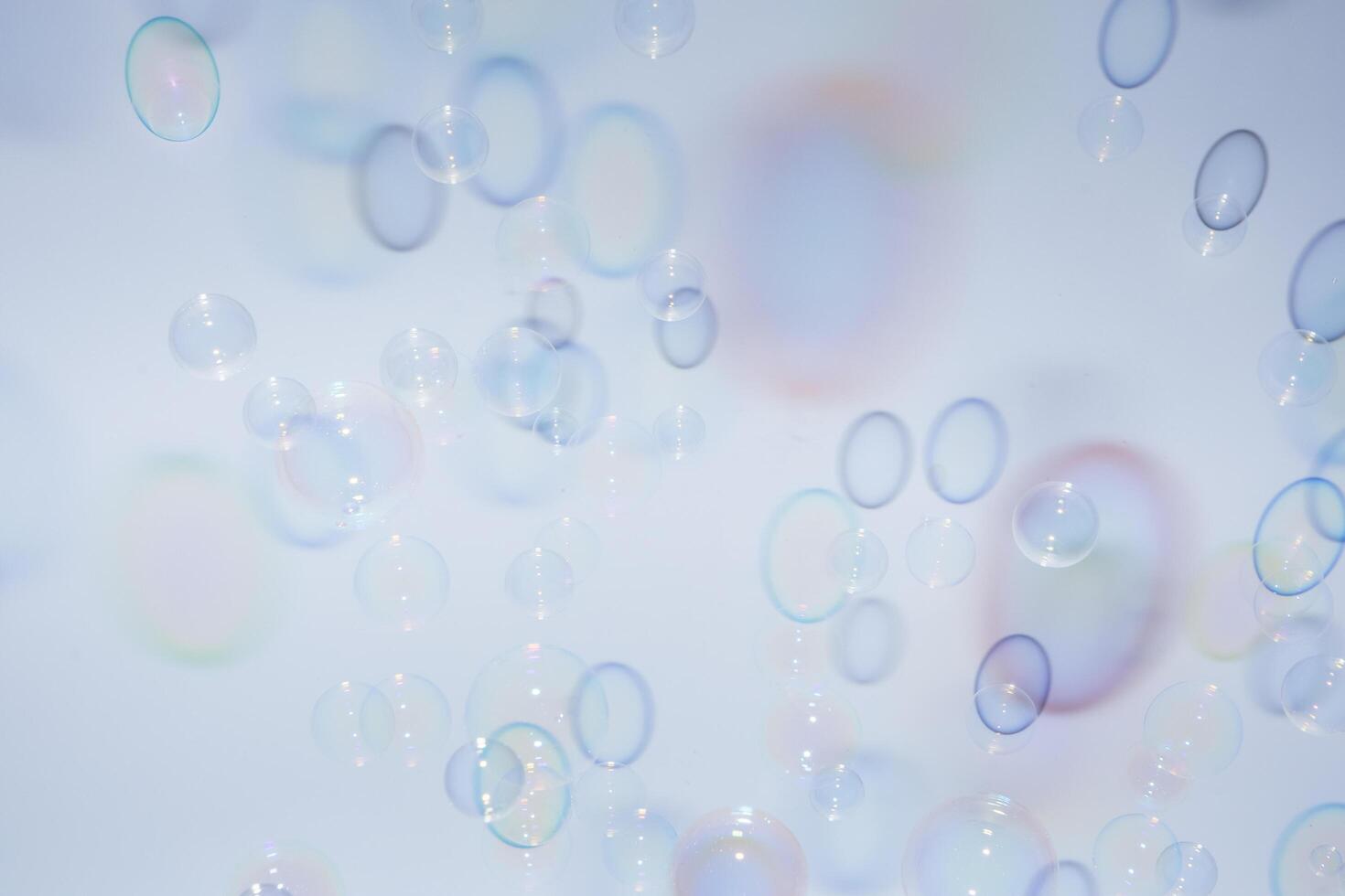 Bubbles in front of greyish-white background photo