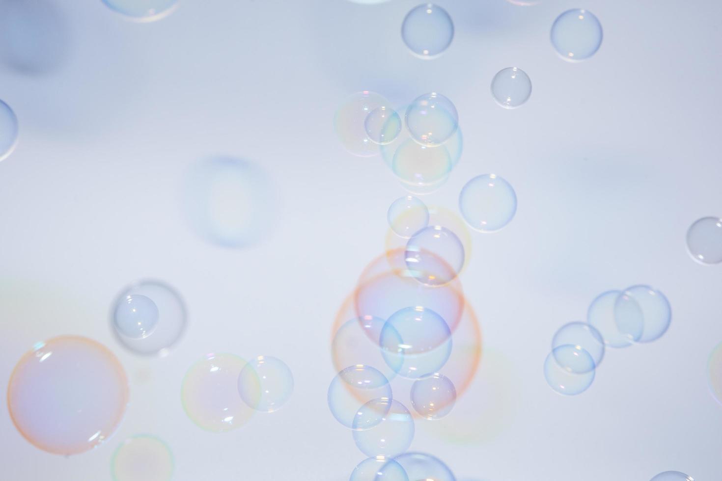 Bubbles in front of greyish-white background photo