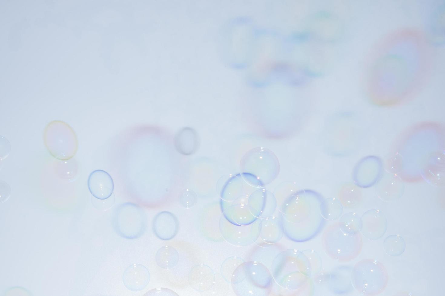 Bubbles in front of greyish-white background photo