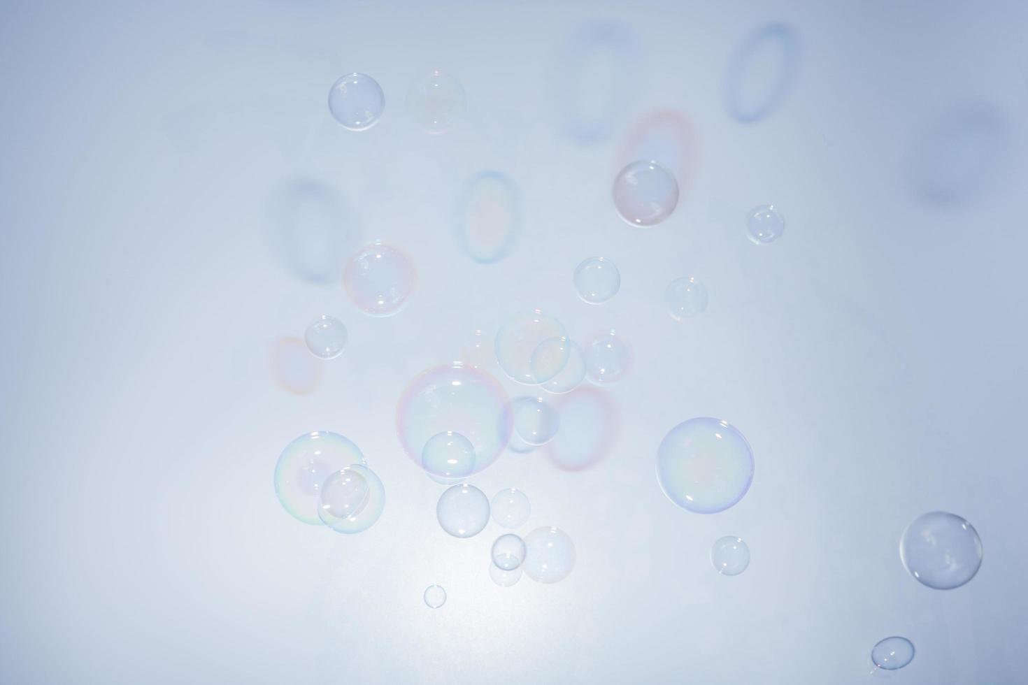 Bubbles in front of greyish-white background photo