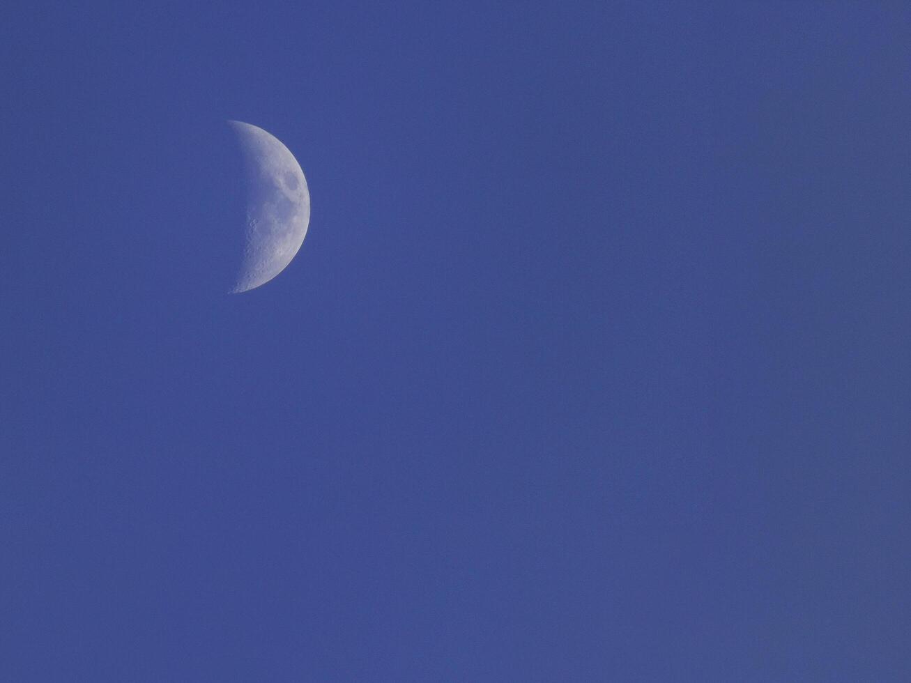 The moon on blue sky photo