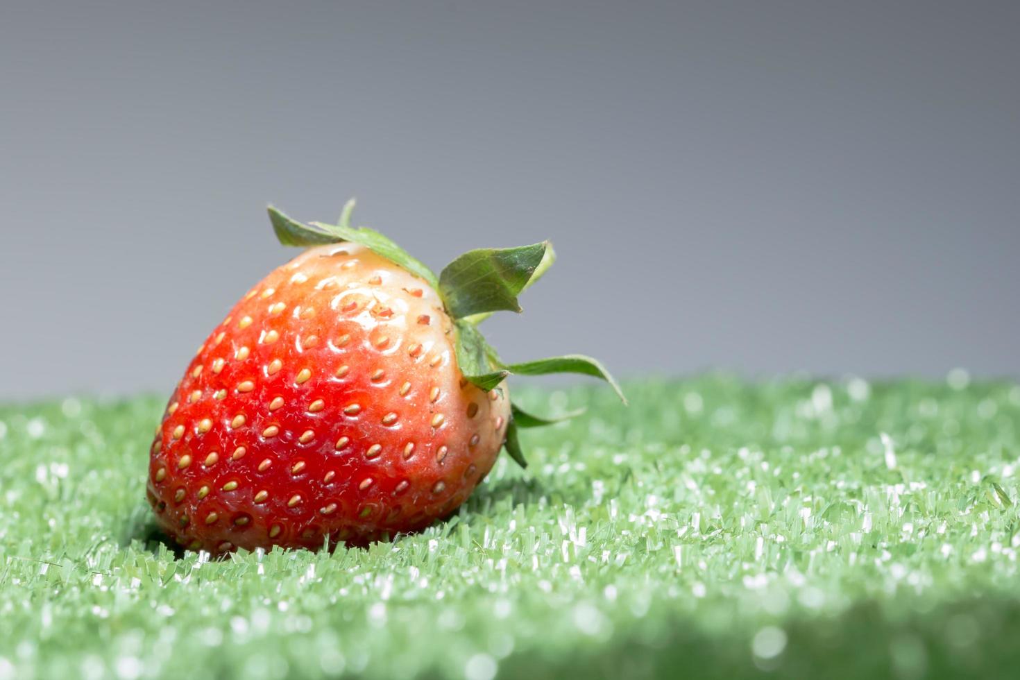 Strawberry on green background photo