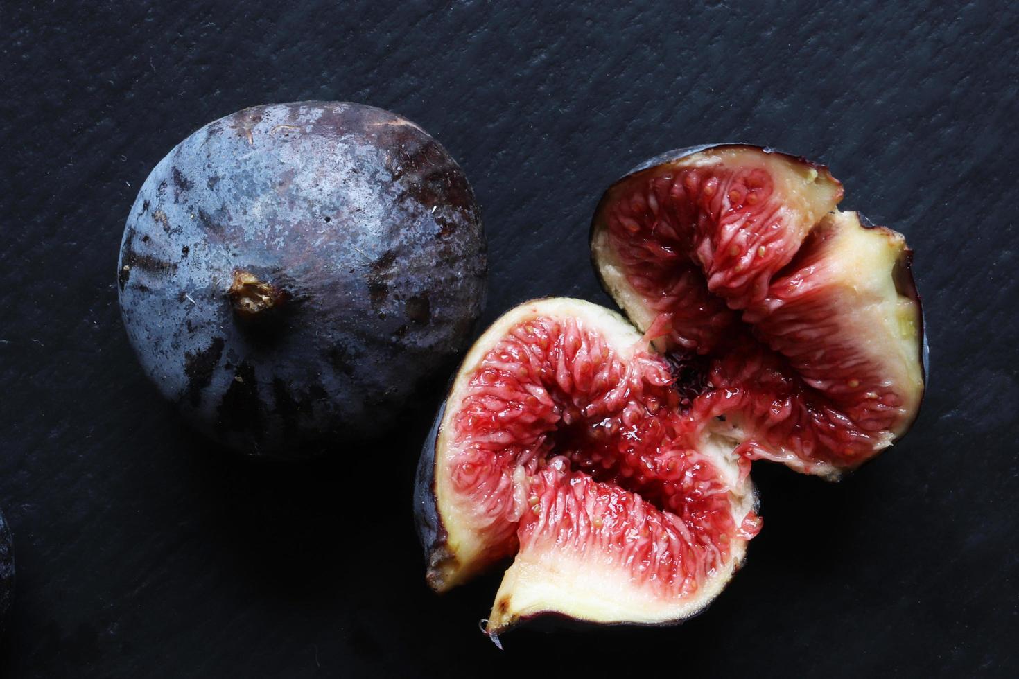 Fresh figs on black photo
