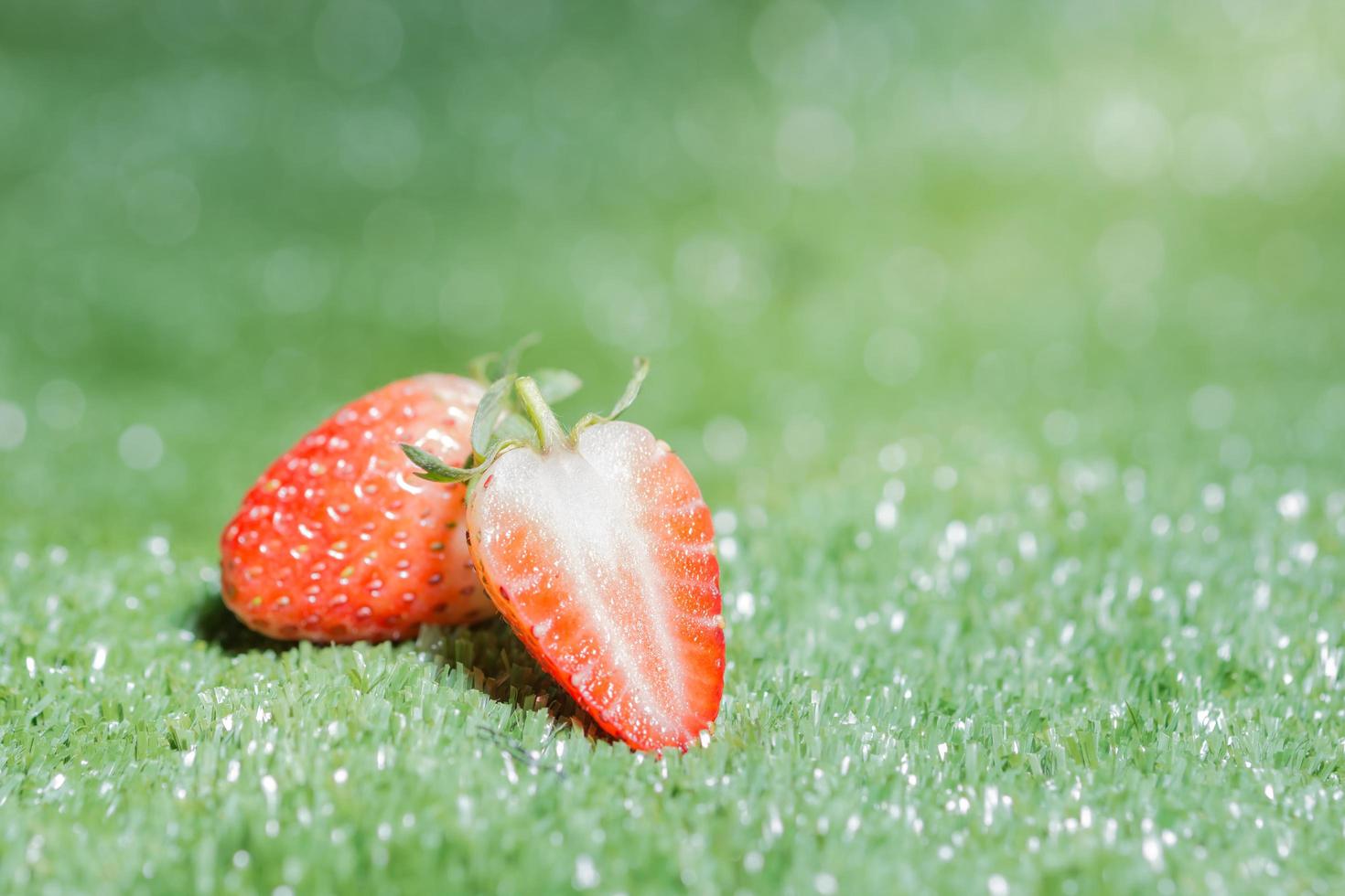 Strawberry on green background photo