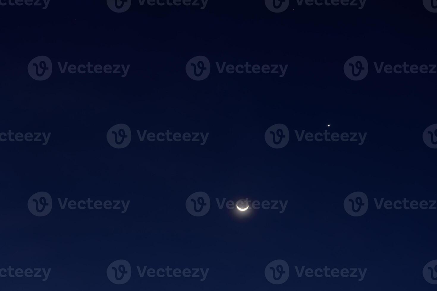 The moon and venus in the night sky photo