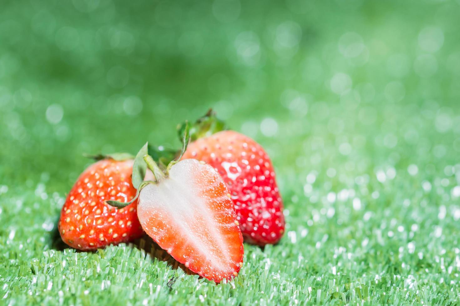 Strawberry on green background photo