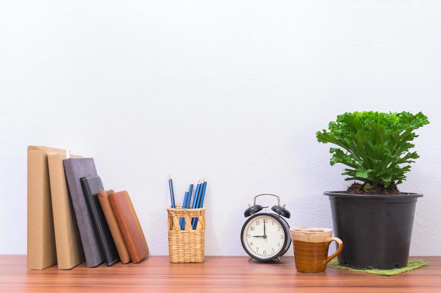 Books and stationery on the desk photo