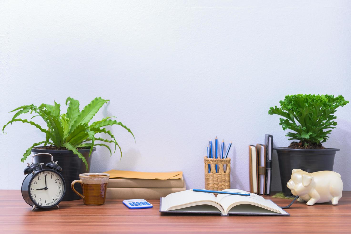 Books and stationery on the desk photo