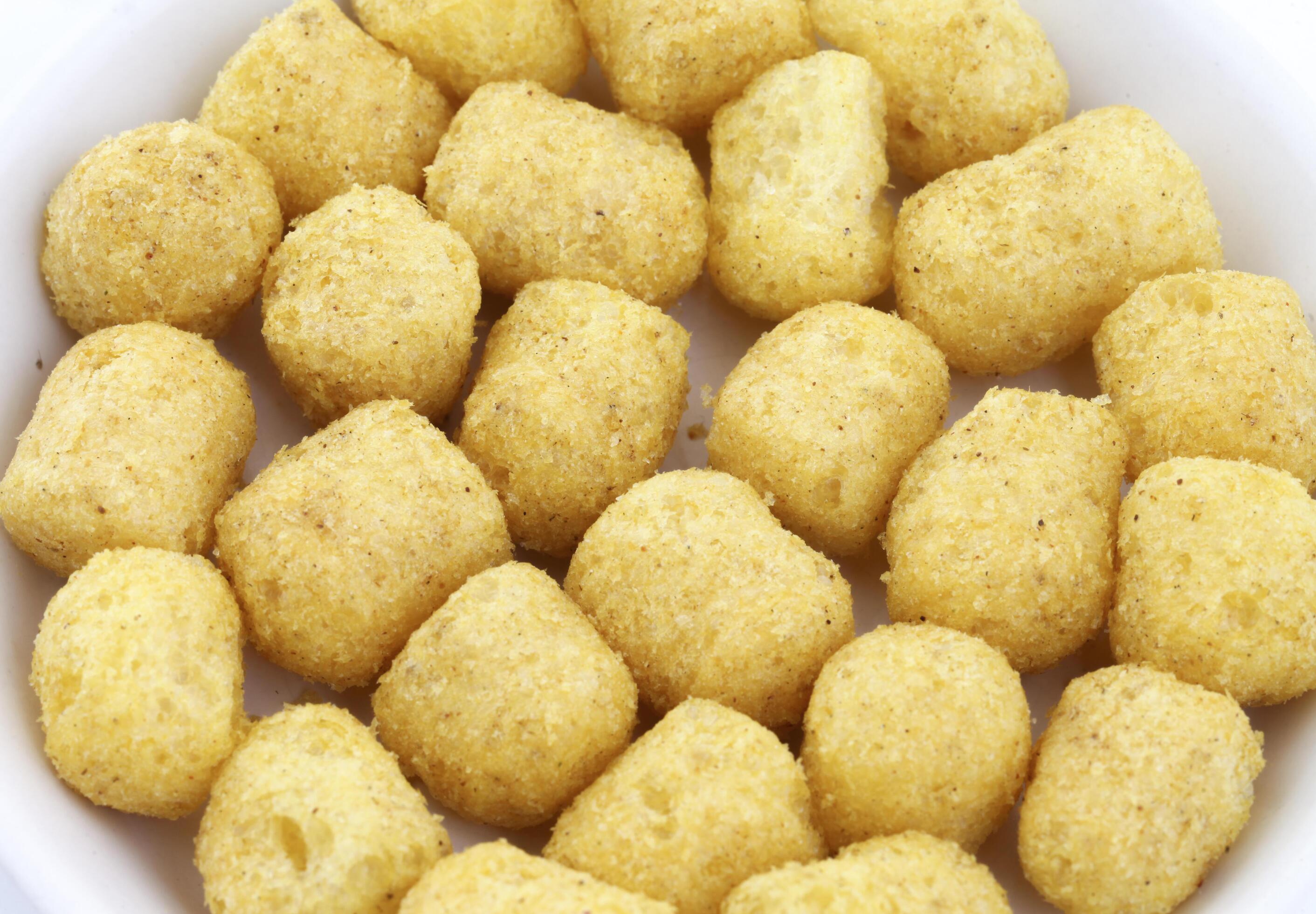 Tasty Round Shaped Yellow Puffs 1898657 Stock Photo at Vecteezy
