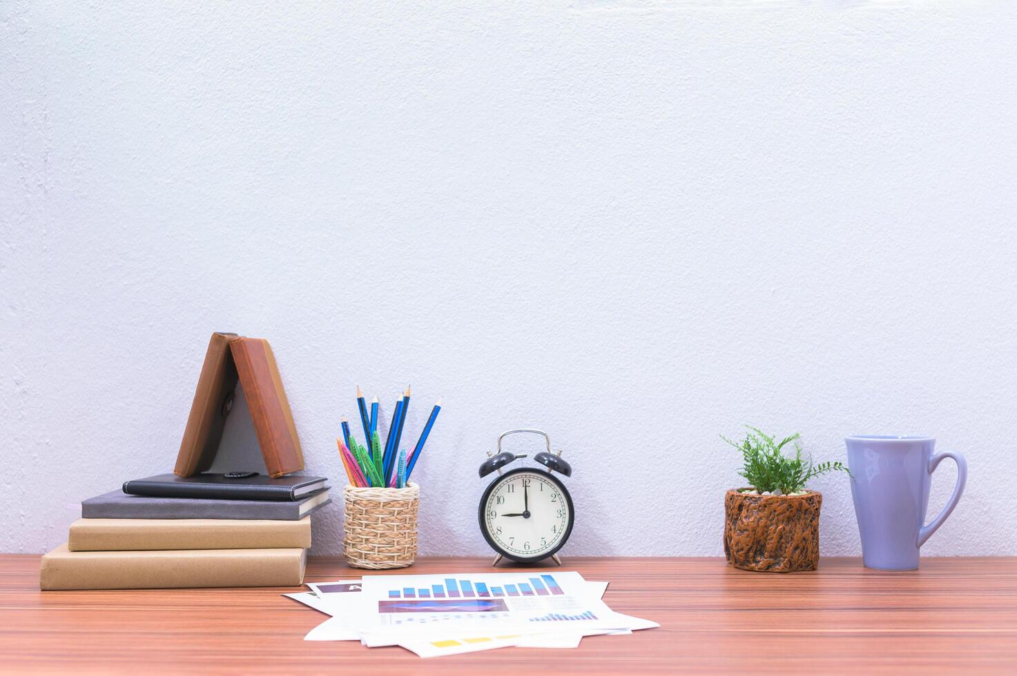 Books and stationery on the desk photo