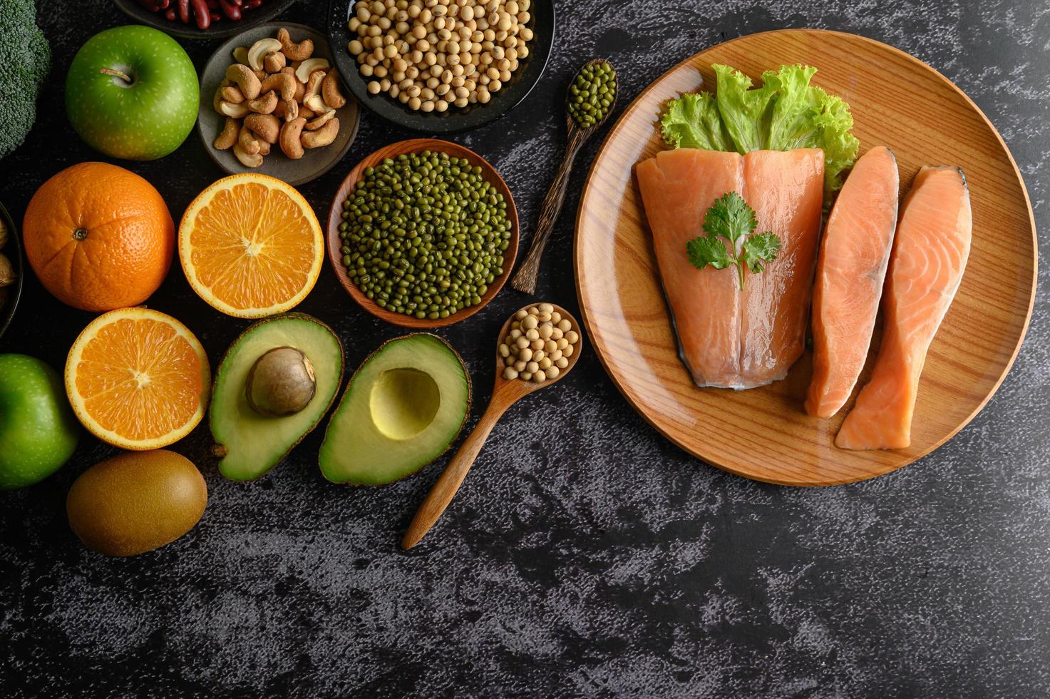 Legumes, fruit and salmon pieces photo