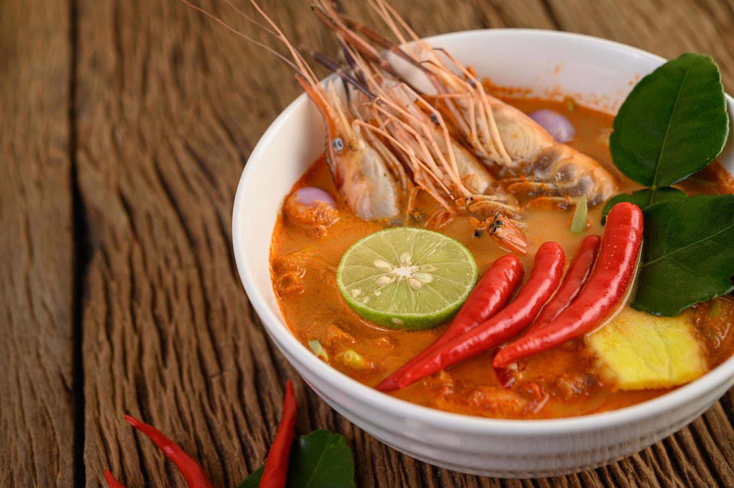 Hot and spicy tom yum kung Thai soup photo