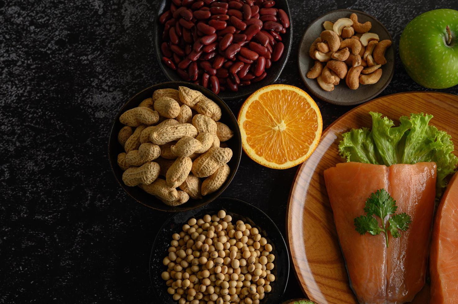 Legumes, fruit and salmon pieces photo