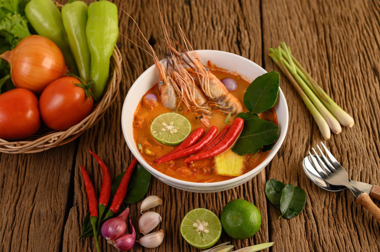 Hot and spicy tom yum kung Thai soup photo