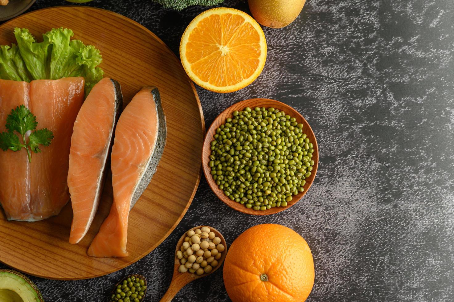 Legumes, fruit and salmon pieces photo