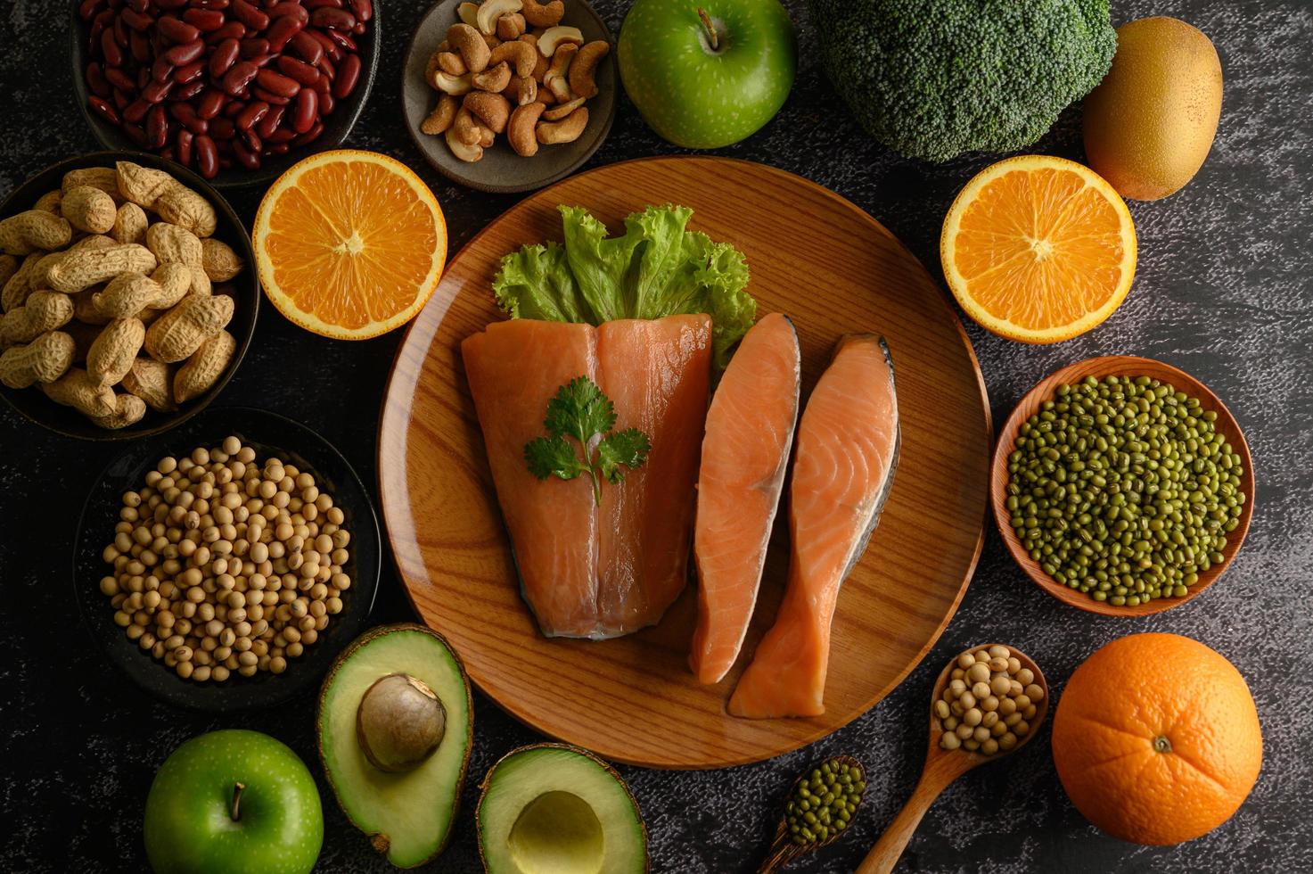 Legumes, fruit and salmon pieces photo