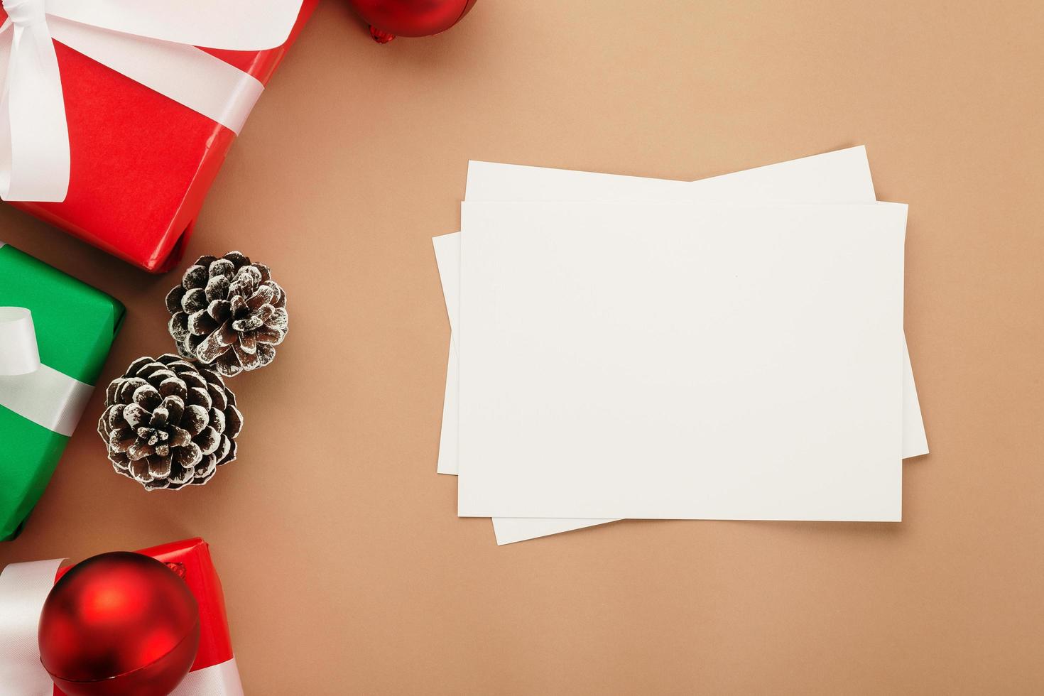 Merry Christmas greeting card mockup template with Christmas gift decorations photo