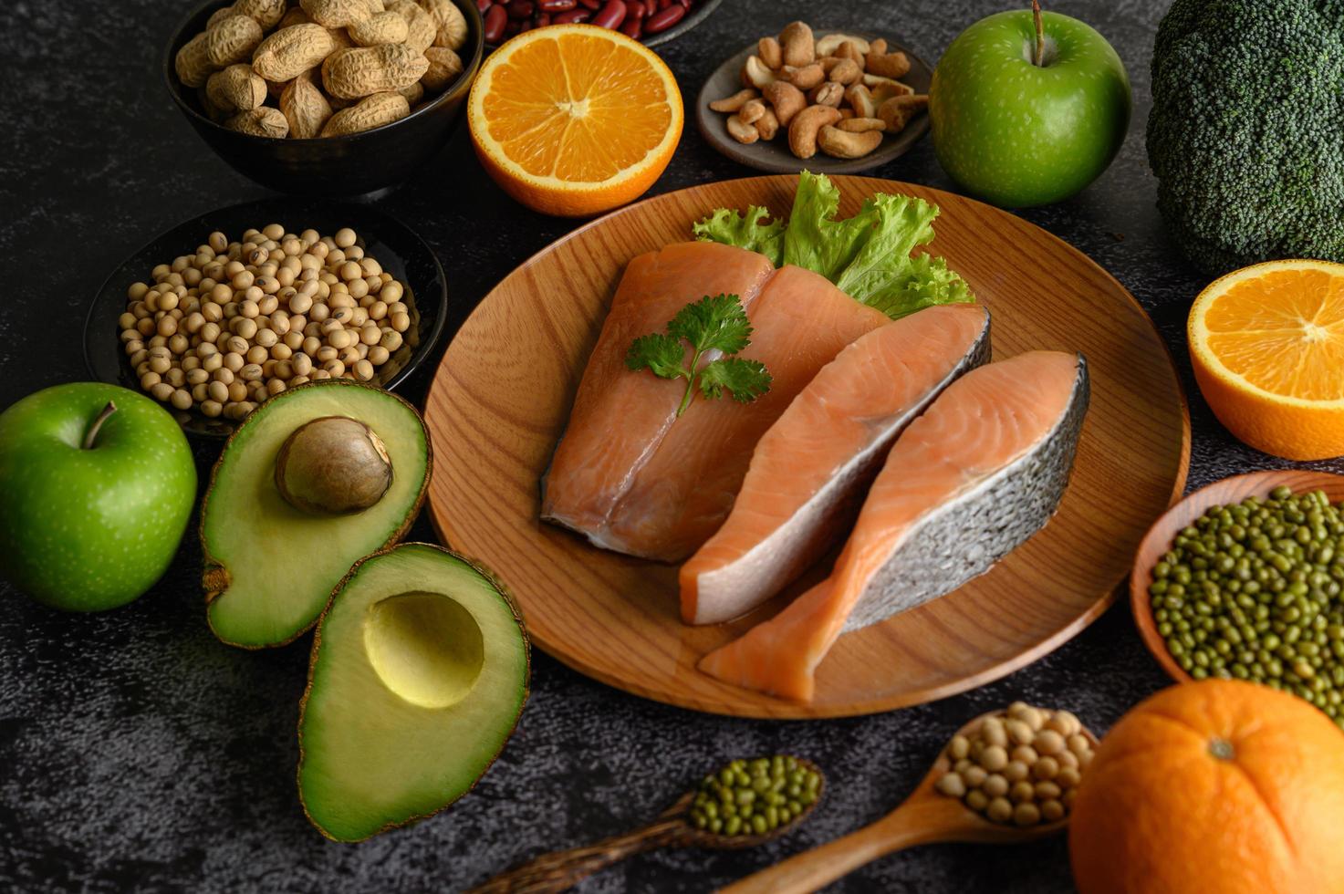 Legumes, fruit and salmon pieces photo