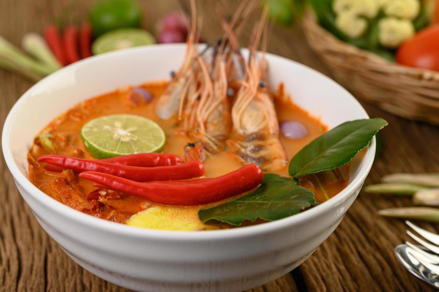 Hot and spicy tom yum kung Thai soup photo