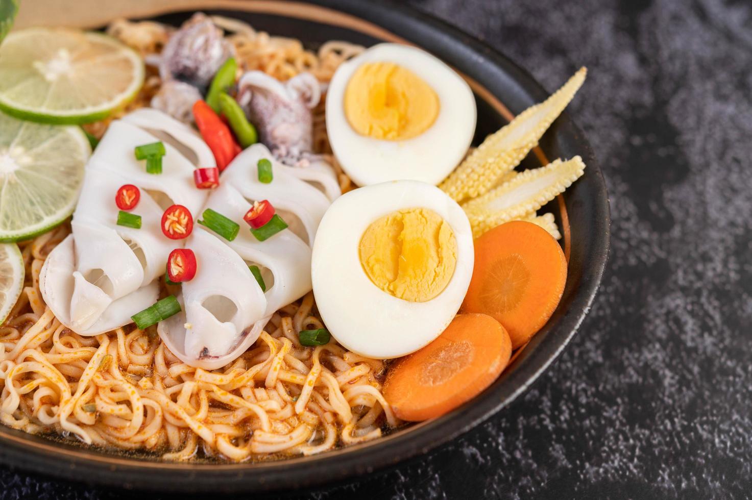 Noodles with squid and boiled egg photo