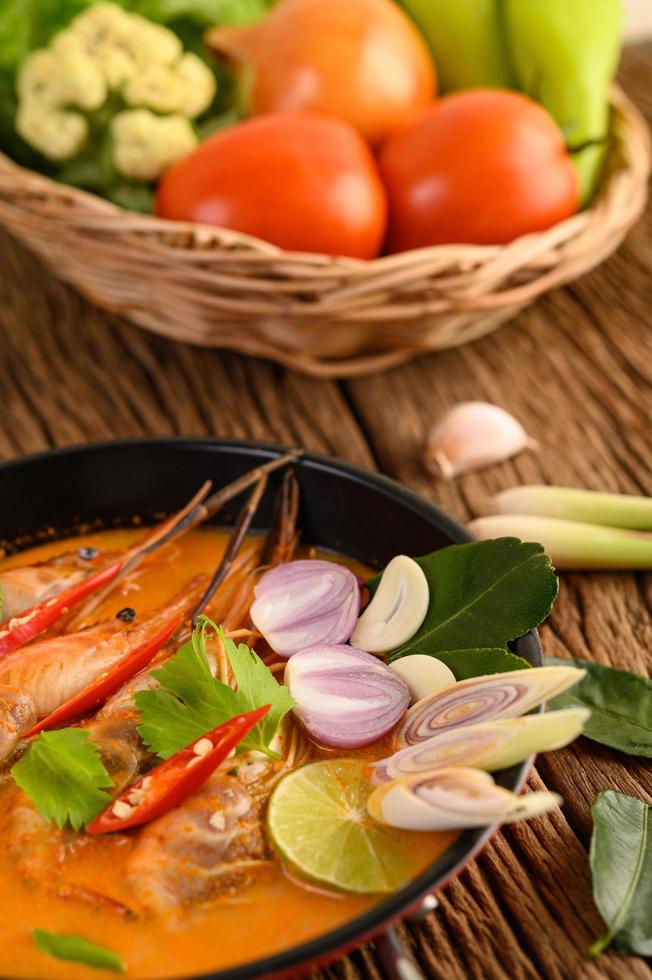 Thai hot spicy soup called tom yum kung with shrimp photo