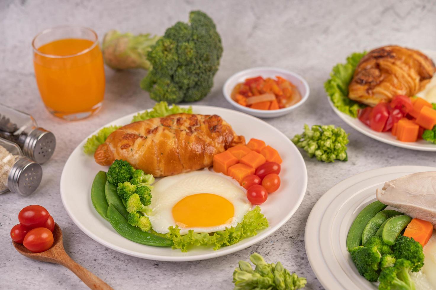 Fresh egg croissant and vegetable breakfast photo