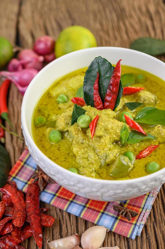 Green curry with limes, red onion, lemon grass, garlic and kaffir leaves photo