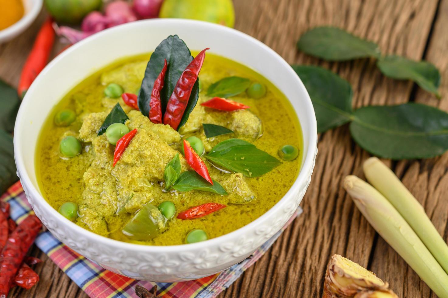 Green curry with limes, red onion, lemon grass, garlic and kaffir leaves photo