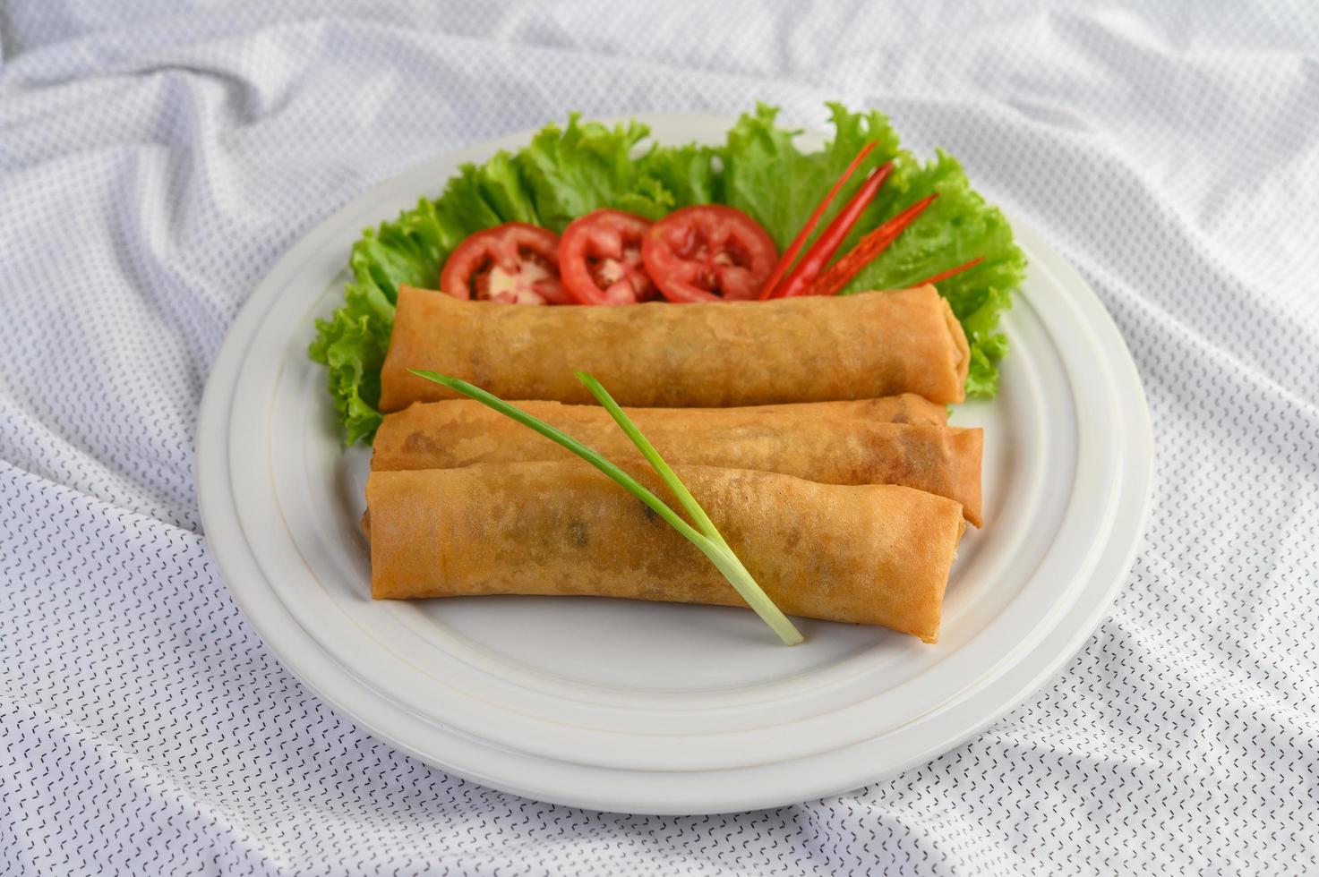 Fried egg roll with salad photo