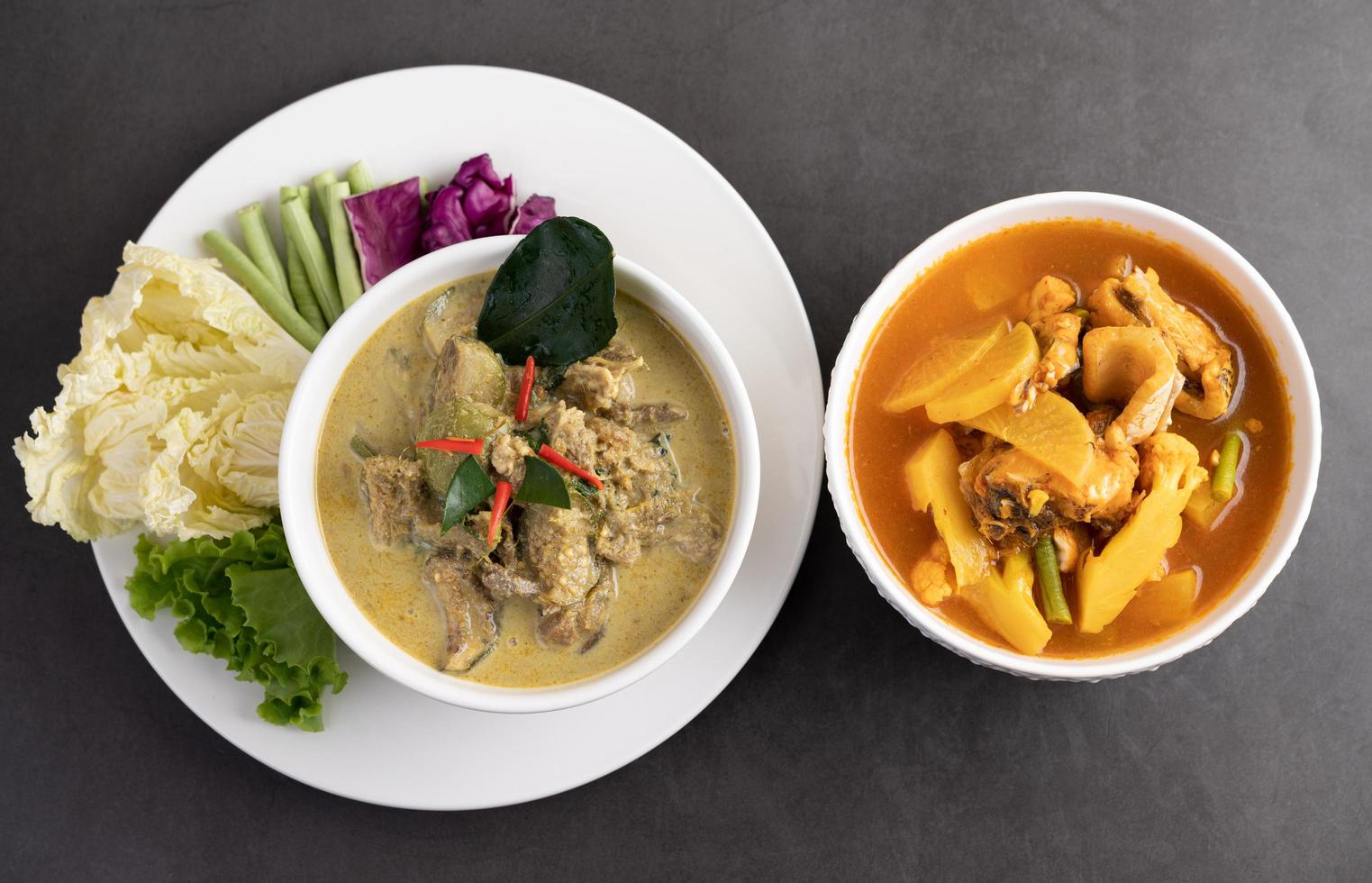 Chicken green curry and snakehead fish curry photo
