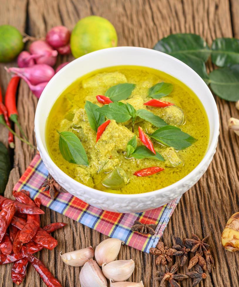 Green curry with limes, red onion, lemon grass, garlic and kaffir leaves photo