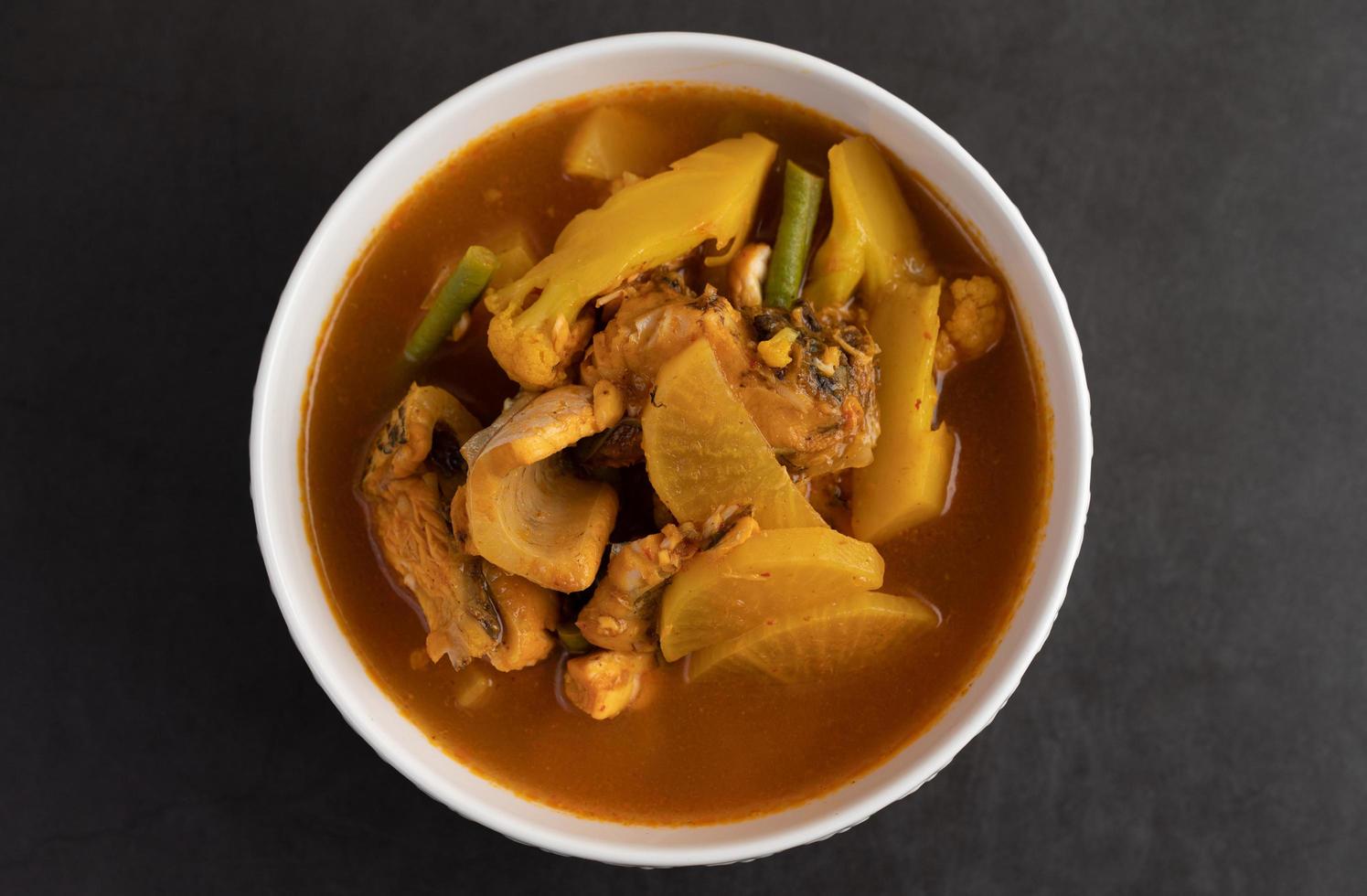 Yellow curry with snakehead fish photo