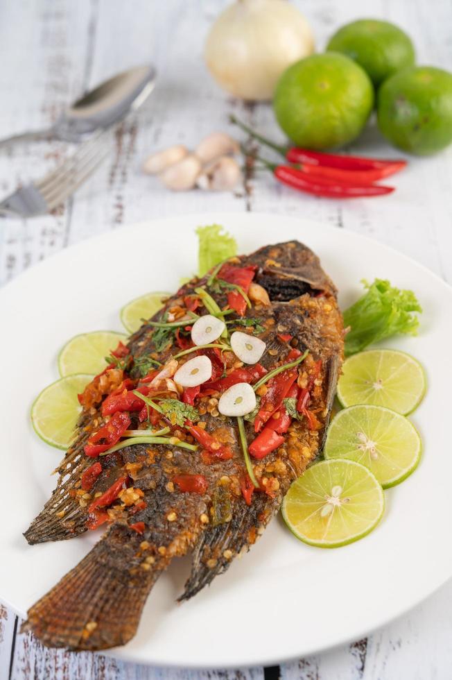 Fried whole tilapia with chili sauce photo