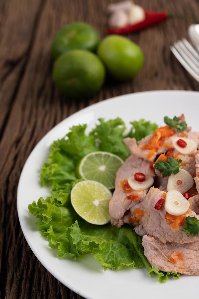 Spicy lime pork with salad photo