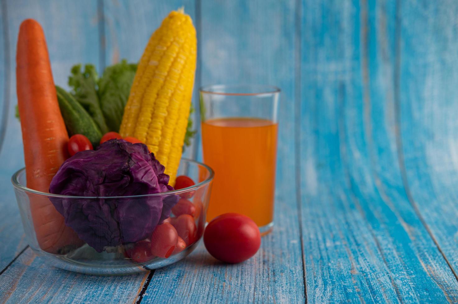 Tomatoes, carrots, cucumbers and purple cabbage photo