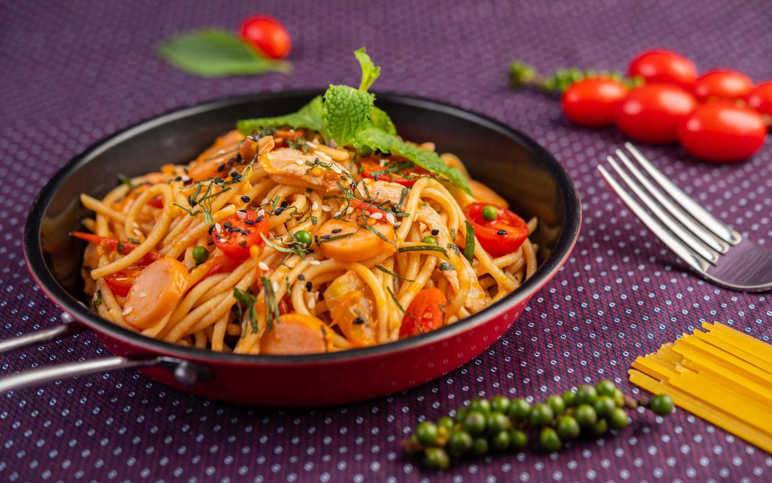 Spiced spaghetti in a frying pan photo