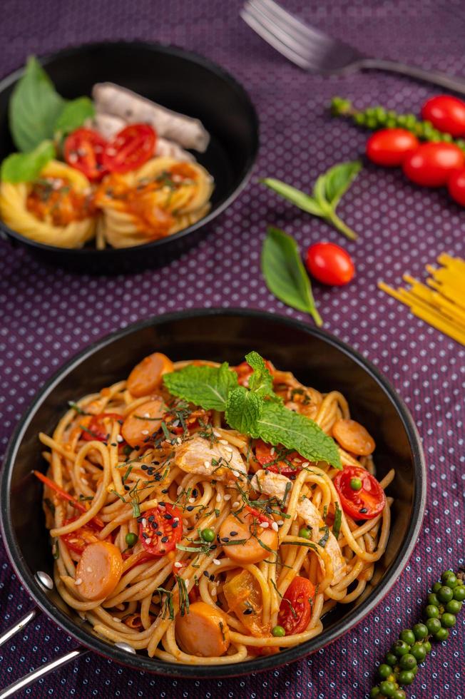 Spiced spaghetti in a frying pan photo