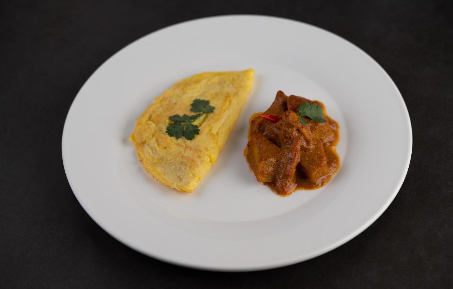 Omelette and massaman curry photo