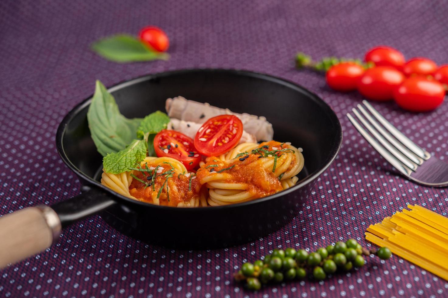 Spiced spaghetti in a frying pan photo