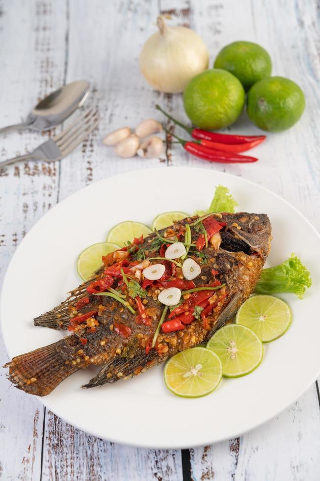 Fried whole tilapia with chili sauce photo