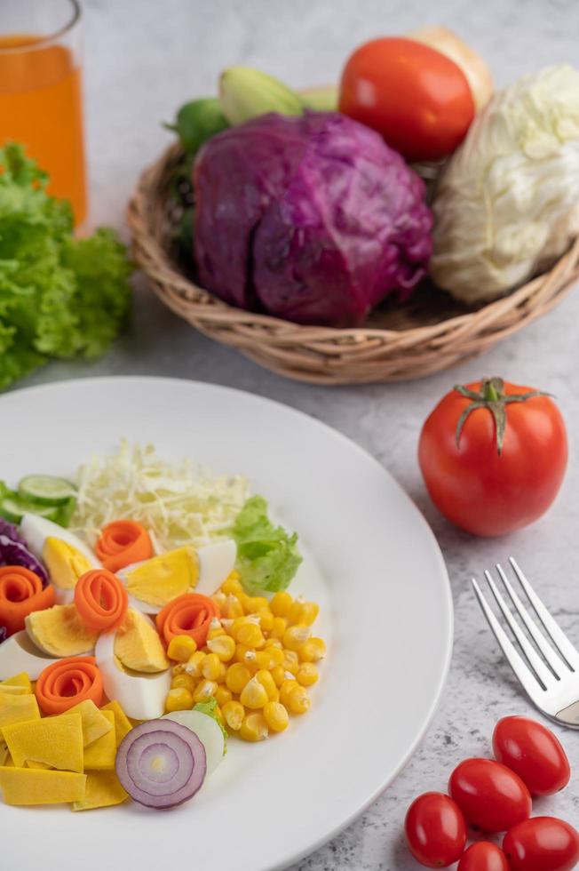 A plated salad with vegetables photo